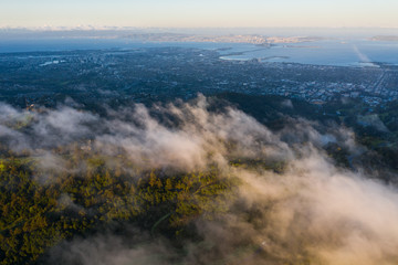 At sunrise, clouds drift over the East Bay hills in the San Francisco Bay area of California.