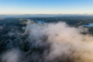 Fototapeta na wymiar Aerial of Clouds Drifting Over East Bay Hills and Reservoirs in California