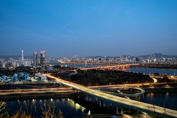 Fototapeta na wymiar The night view of Seoul. Cars on the road. Traffic at Seoul City,South Korea.
