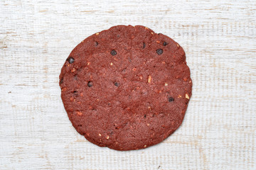 Red velvet cookies, butter cookies onwhite wooden background, closeup