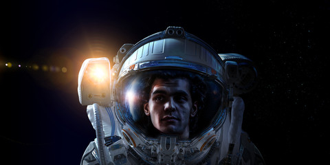 Fototapeta premium Astronaut in space on planet orbit.