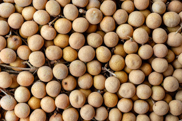 Thai fruit longan background. Longan exotic fruit for sell in street market, Thailand, closeup, top view
