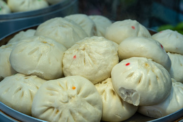 Traditional Chinese steamed bun in tray for sell in Chinatown market, Singapore