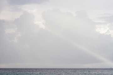 ray of light in the sky in cloudy weather. sky over the sea