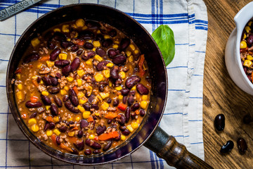 Chili corn carne on wood table
