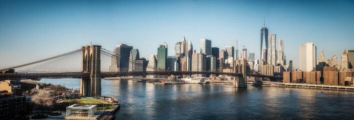 Brooklyn bridge and Manhattan at sunny day, New York City, USA