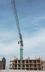 Construction crane building new building outdoor. Urban story