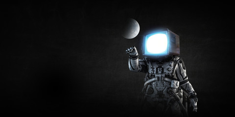 Astronaut with TV head on black background. Mixed media.
