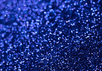 Blue glitter texture. Festive sparkling sequins background closeup. Wpaper for Valentine, New Year or Christmas Holidays