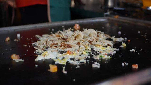 Cooking kothu parotta very popular food in Tamil nadu and Kerala India and Sri Lanka. Spicy hot Indian dish paratha made of wheat flour.