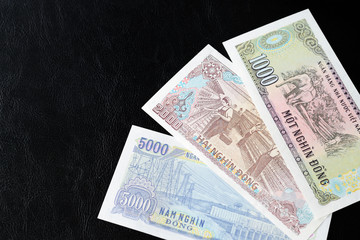 Vietnamese dong bills on a dark background close up. Money background