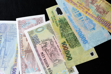 Vietnamese dong bills on a dark background close up. Money background