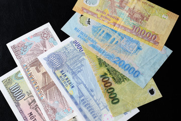 Vietnamese dong bills on a dark background close up. Money background