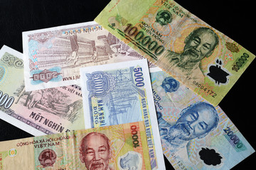 Vietnamese dong bills on a dark background close up. Money background