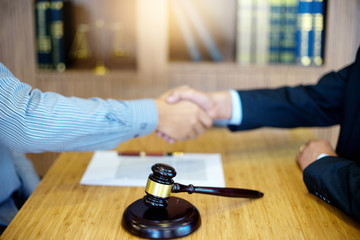 Justice lawyers Handshake to businessman or client