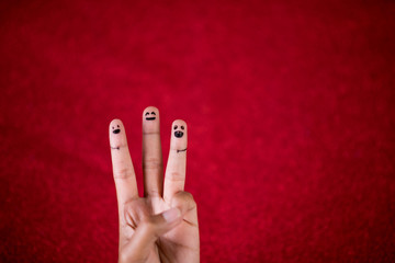 Red background and fingers and cute smile Art concept