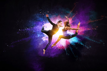 Young modern ballet dancers in a jump. Mixed media