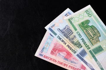 Outdated Belarusian rubles on a dark background close up