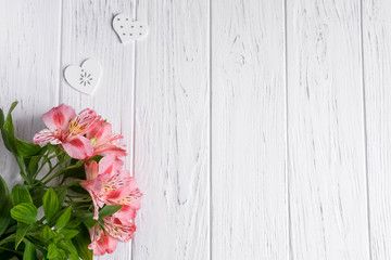 Background for text banner on a dark wooden background with white flowers. Blank, frame for text. Greeting card design with flowers. Aalstroemeria on wooden background. View from above