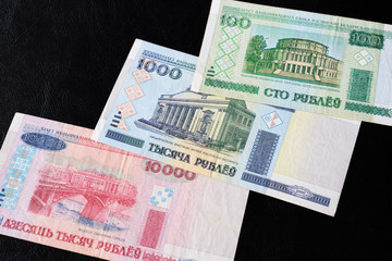 Outdated Belarusian rubles on a dark background close up