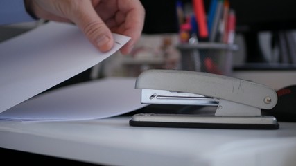 Businessman Job In Office Archive Contracts and Documents Using a Stapler