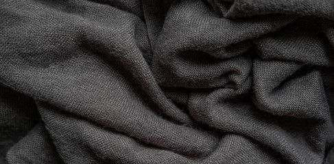 Macro photo of fabric gray. Knitting, wool. Texture of fabric with folds for designers. Blank for banner atelier, mester