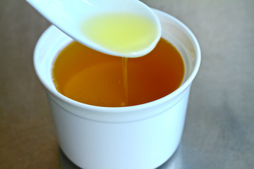 Soil bean vegetable oil in a bowl close up