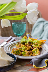 Pumpkin flowers fried in batter. Traditional italian dish. Home dinner and flowers.