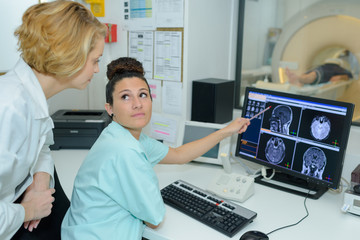 nurse pointing at computer screen