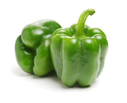 fresh green bell pepper (capsicum) on a white background