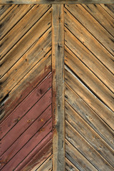 Old  painted rustic wooden door.  Detail texture, background 
