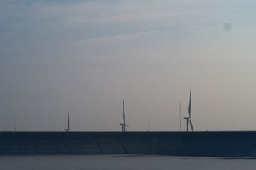 wind turbines at sunset
