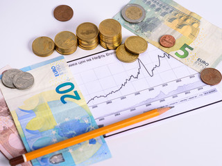 graph of rising prices and money on a white background