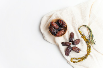 Ramadan Kareem Festival, Dates at bowl with rosary on white isolated background