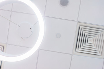 Design and details of the modern device ceilings in the room.