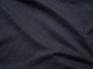 Fototapeta na wymiar black sportswear shirt background,silk cloth texture