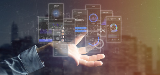Businessman holding User interface screens with icon, stats and data 3d rendering