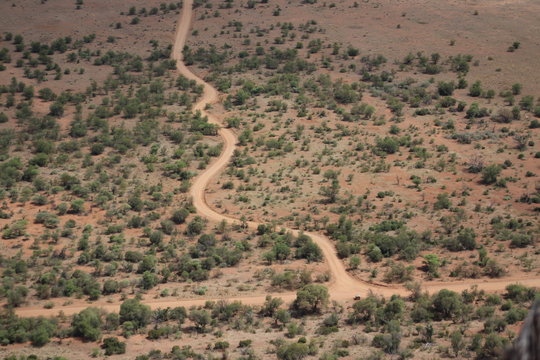 Dirt road winding through arid landscape