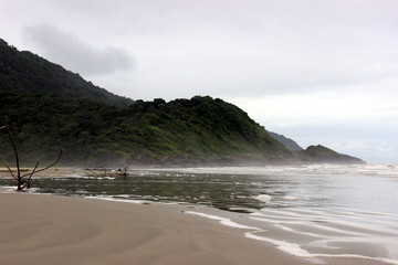 Cloudy daytime landscape of Carambore beach, located at Juréia-Itatins Ecological Station, Peruíbe, São Paulo, Brazil.