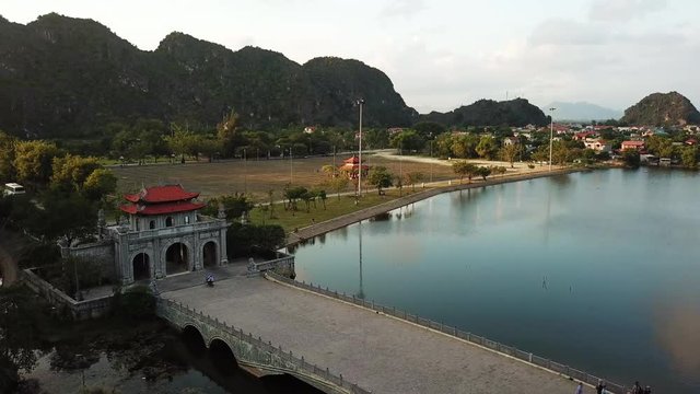 Hoa Lu, breathtaking ancient capital of of Vietnam. Aerial pan as sunsets over mountains