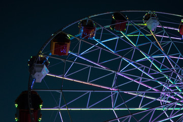 Night view of ferris wheel at city park 