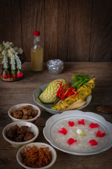 Khao-Chae, Cooked Rice Soaked in Iced Water in the white bowl and Eaten with the Usual Complementary Food and to decorate by flower, scented water.