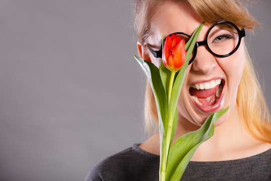 Cheerful girl with flower.