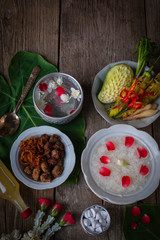 Khao-Chae, Cooked Rice Soaked in Iced Water in the white bowl and Eaten with the Usual Complementary Food and to decorate by flower, scented water.