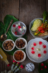 Khao-Chae, Cooked Rice Soaked in Iced Water in the white bowl and Eaten with the Usual Complementary Food and to decorate by flower, scented water.