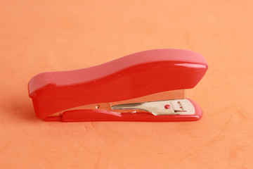red stapler in color background