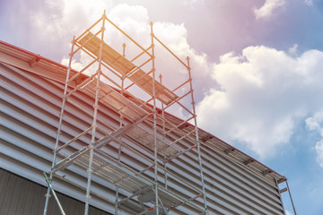 kwikstage scaffolding frame roof service at construction site.