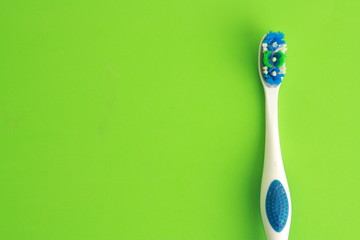blue and green white toothbrush