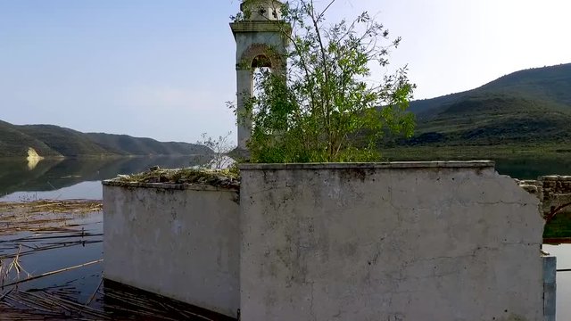 Abandoned old church immersed under reservoir water in Cyprus