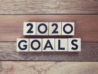New Year goal concept - 2020 GOALS written on wooden blocks.
